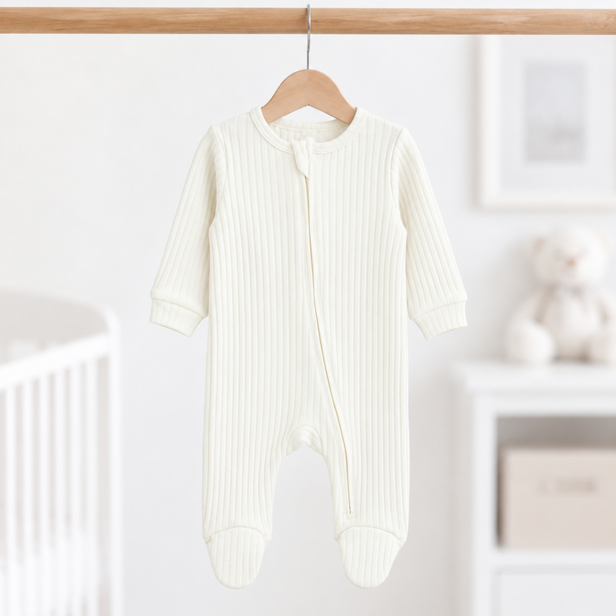 Marshmallow ribbed cotton baby sleepsuit in neutral cream 0–3 months