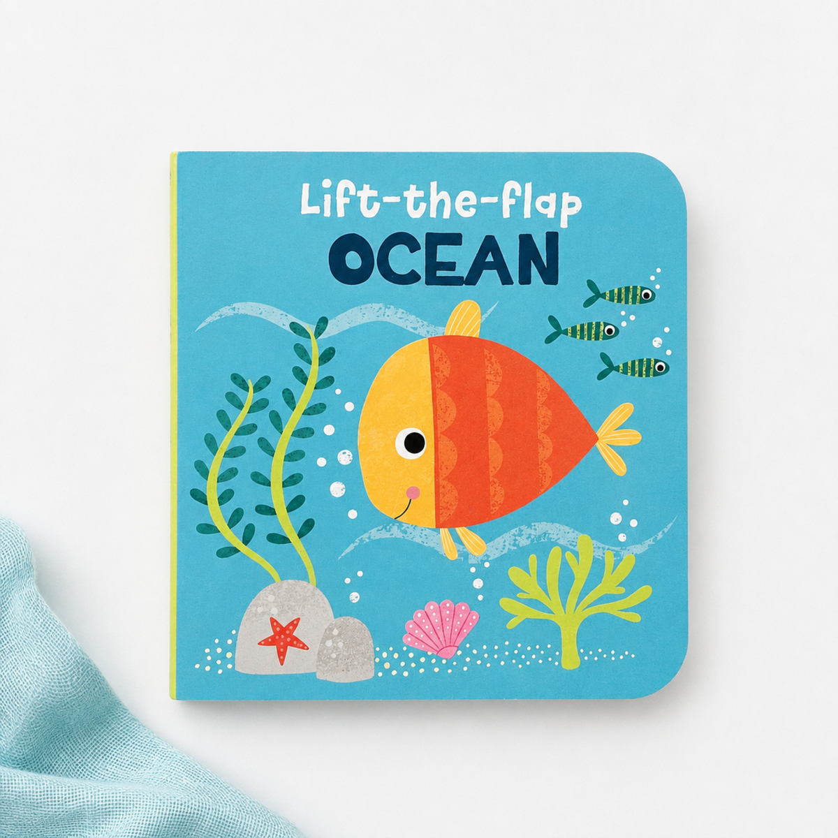 Ocean mini lift-the-flap baby book with colourful fish illustration for little hands