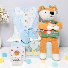Load image into Gallery viewer, Rainbow Wishes baby boy gift hamper – includes outfit, plush fox, sensory book, baby oil, and keepsake rainbow decoration
