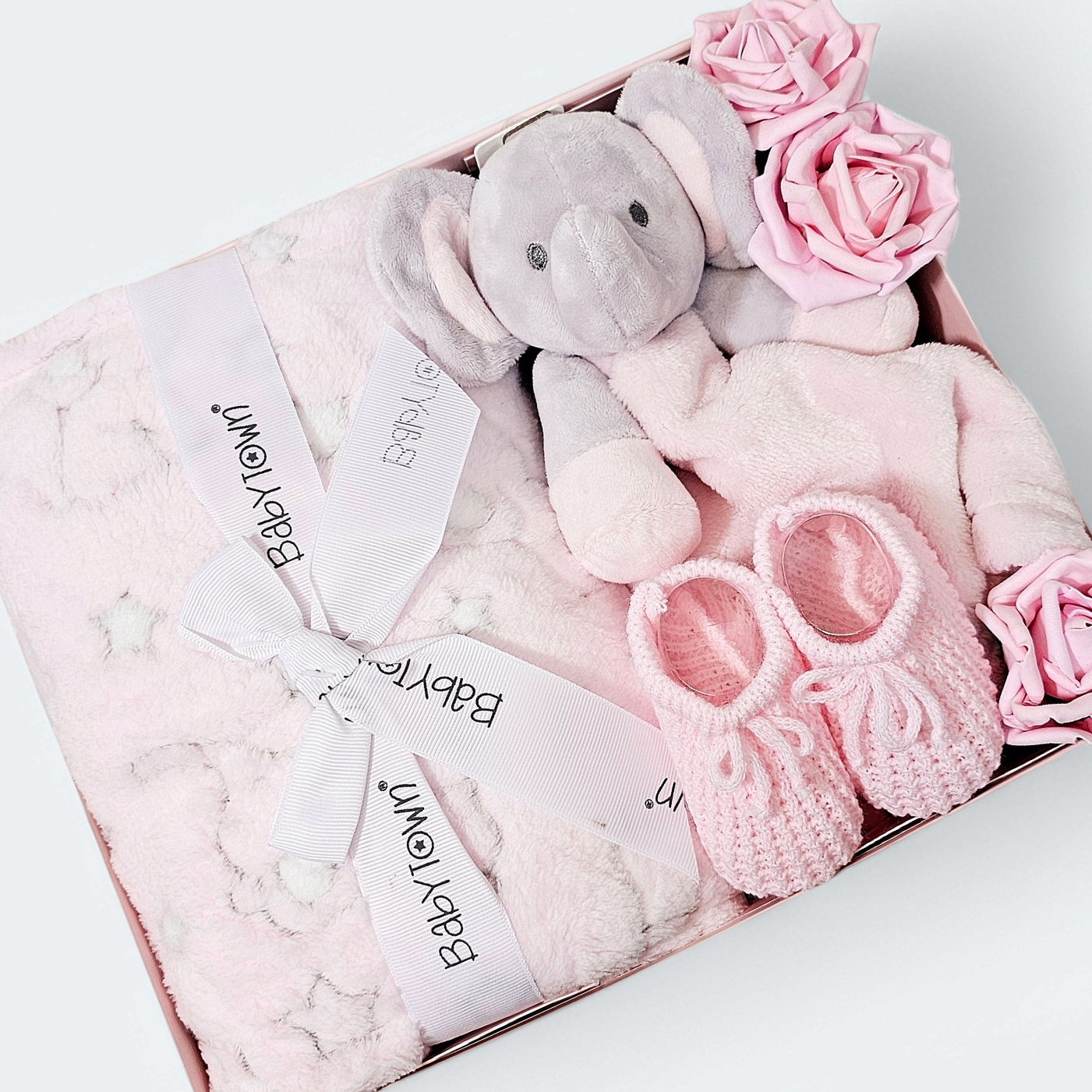 Baby girl hamper filled with soft pink baby gifts and keepsakes, perfect for newborn or baby shower gifting.