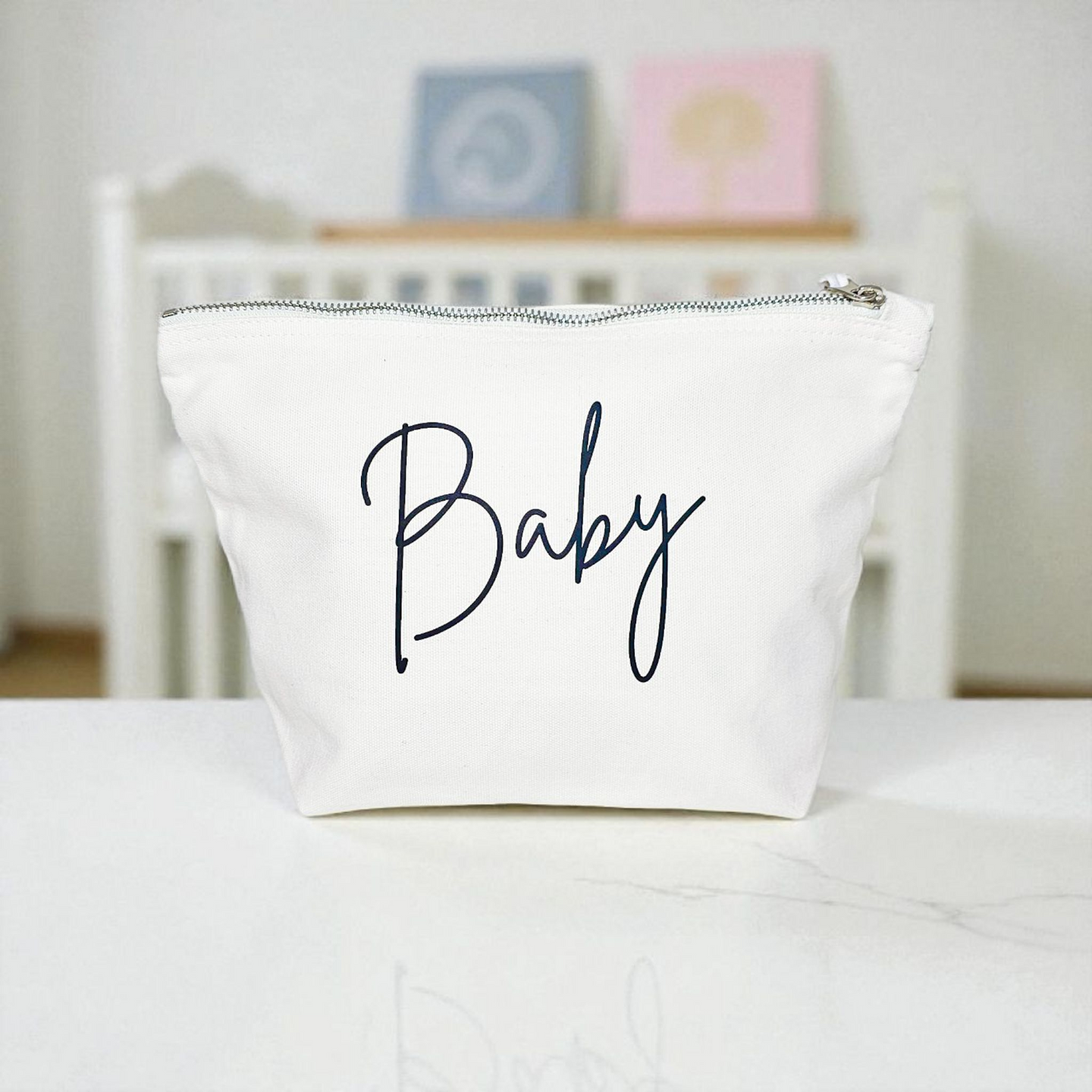 White canvas zip pouch with black “Baby” lettering