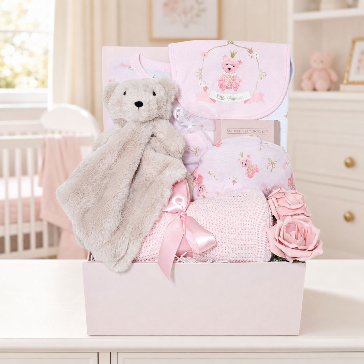 Baby girl gifts hamper with cotton clothes and comforter