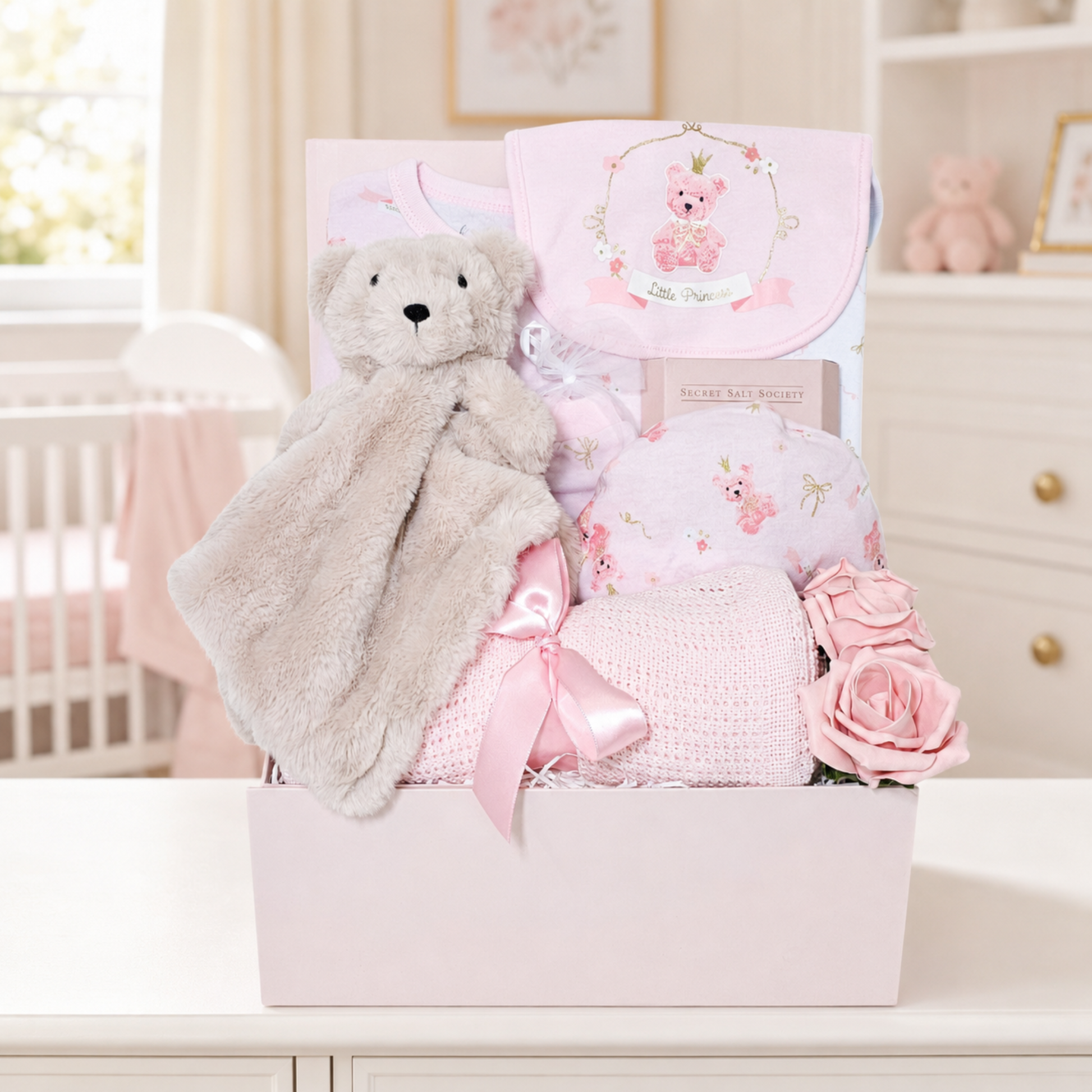 Baby girl gifts hamper with cotton clothes and comforter