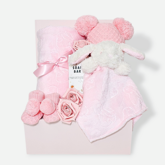 Baby girl gift box with pink bunny comforter, plush blanket, pom-pom hat and booties