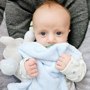 Sleepy Baby Holding a Comforter - Ema and Boo