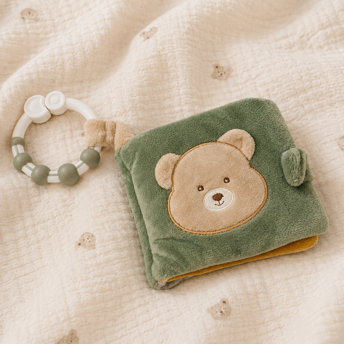 A soft baby sensory book with a bear face  - Baby Toys