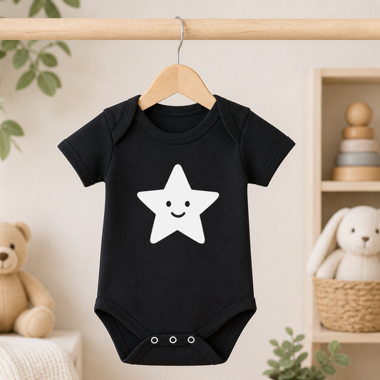Minimalist baby outfit black bodysuit with white star on hanger modern baby gift UK