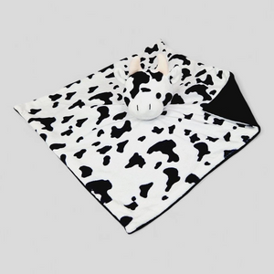 Monochrome cow comforter for newborn sensory play