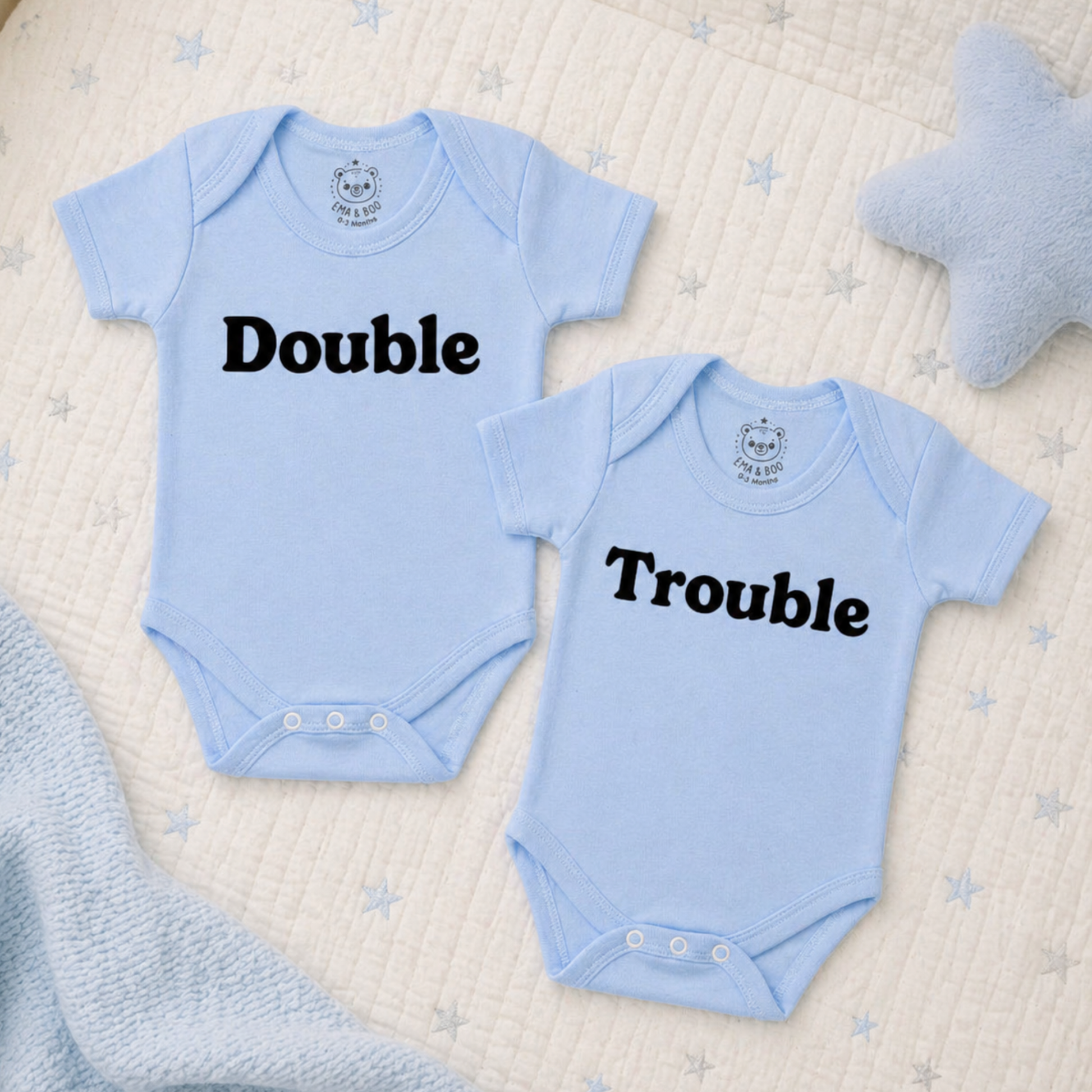 Blue cotton twin bodysuits with “Double” and “Trouble” text – newborn twins gifts
