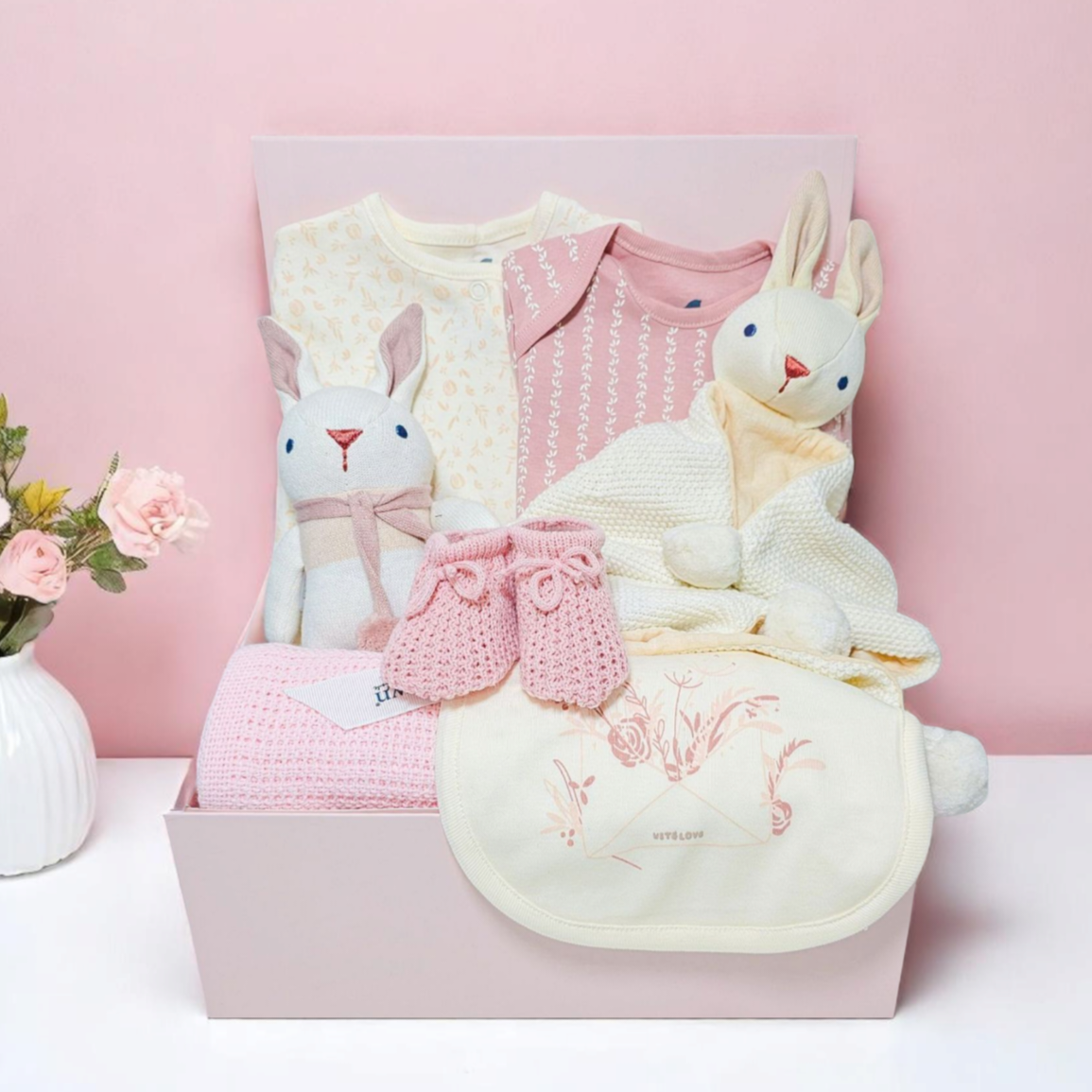 Blush Bunny Baby Girl Gift Hamper – pink newborn hamper with baby clothes, blanket, plush bunny toy, and comforter in keepsake box