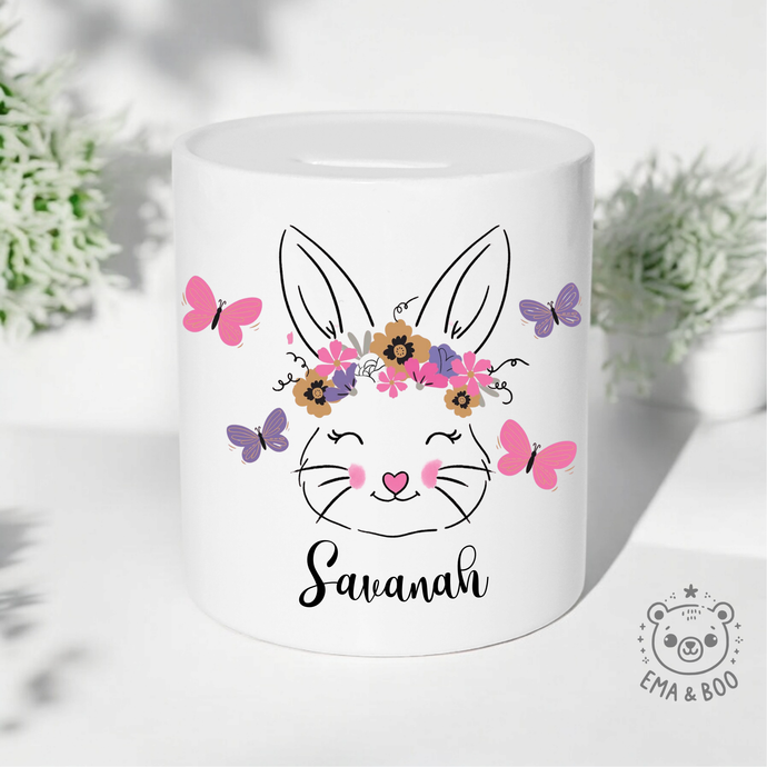 Personalised baby girl money box with bunny, flowers, butterflies and custom name.