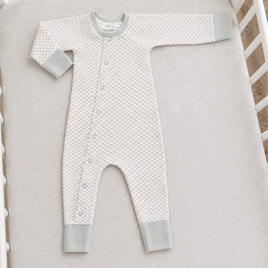 Dove grey organic cotton baby romper 0–3 months with geometric print and grey cuffs