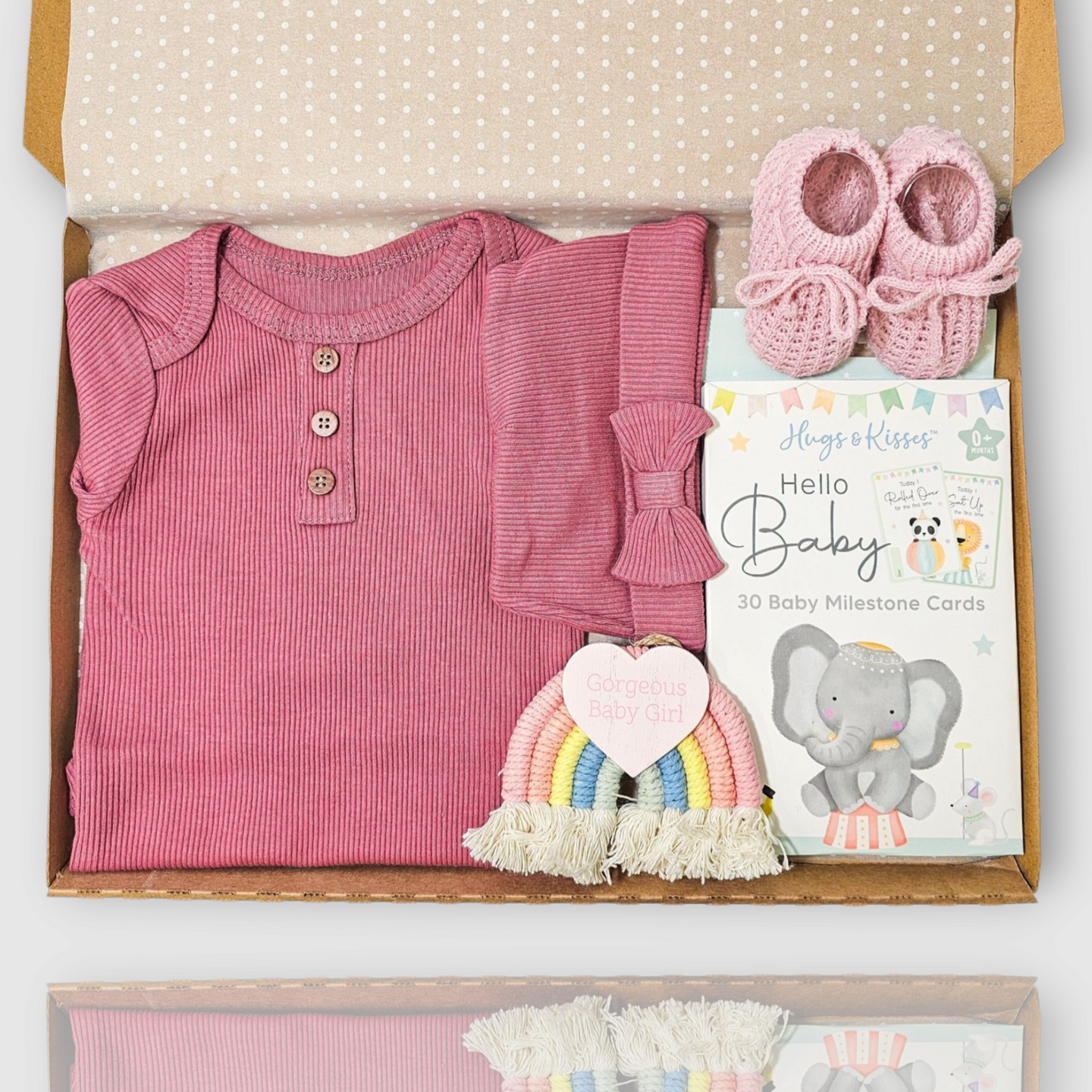 Dusky pink baby girl letterbox gift with bodysuit, hat, booties, rainbow and milestone cards
