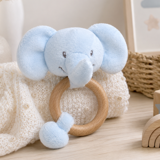 Soft blue elephant baby rattle with a natural wooden teething ring for sensory play and teething relief.