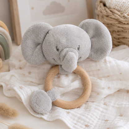 Eco-friendly grey elephant baby rattle with a natural wooden teething ring made from recycled materials.