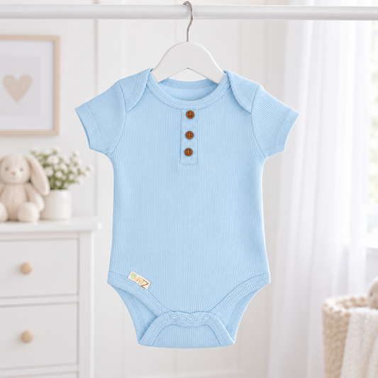 A light blue short-sleeve baby bodysuit with three brown buttons on the chest