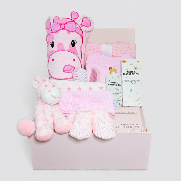Pink giraffe-themed baby hamper with clothes, blanket & rattle