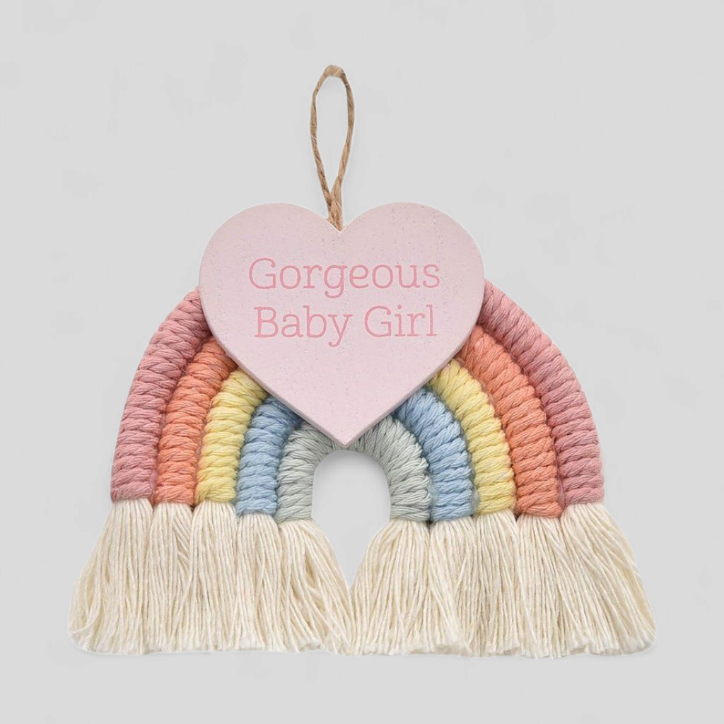 Decorative wall hanging with a rainbow and heart-shaped sign with Gorgeous Baby Girl writting