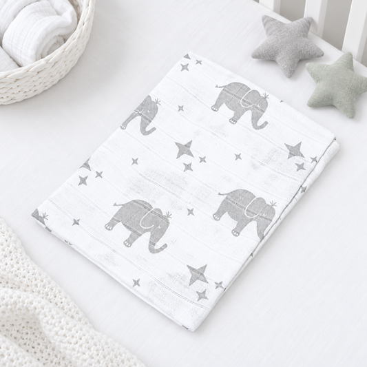 White cotton baby muslin square with grey elephant and star print, 70 × 70 cm.
