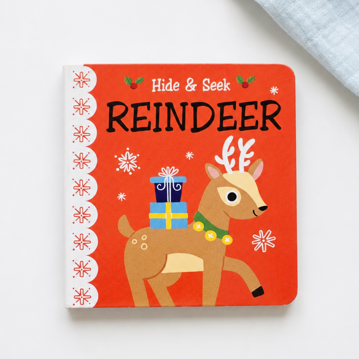 Hide & Seek Reindeer mini Christmas baby book with festive reindeer and presents
