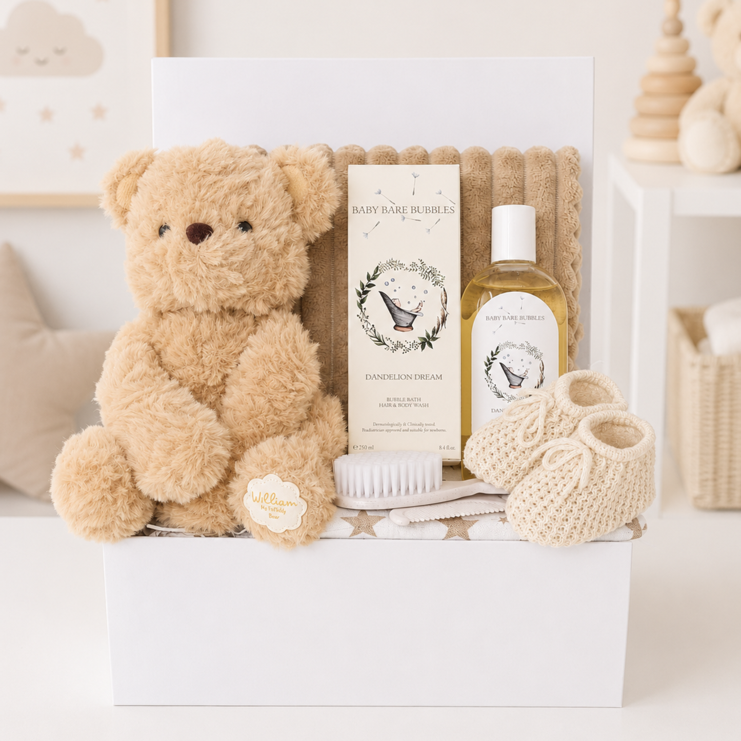 Luxury neutral baby gift box with teddy bear and baby essentials