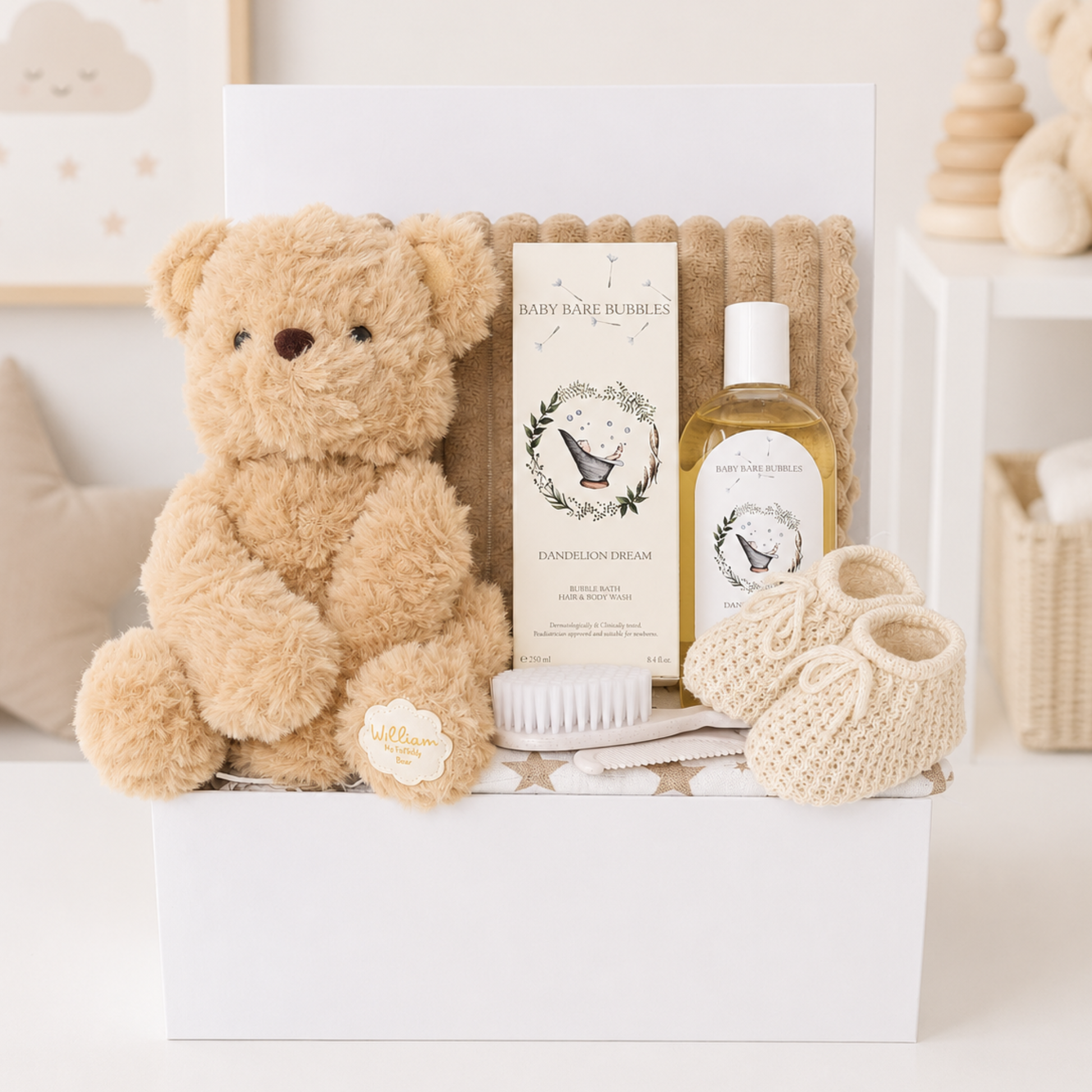 Luxury neutral baby gift box with teddy bear and baby essentials