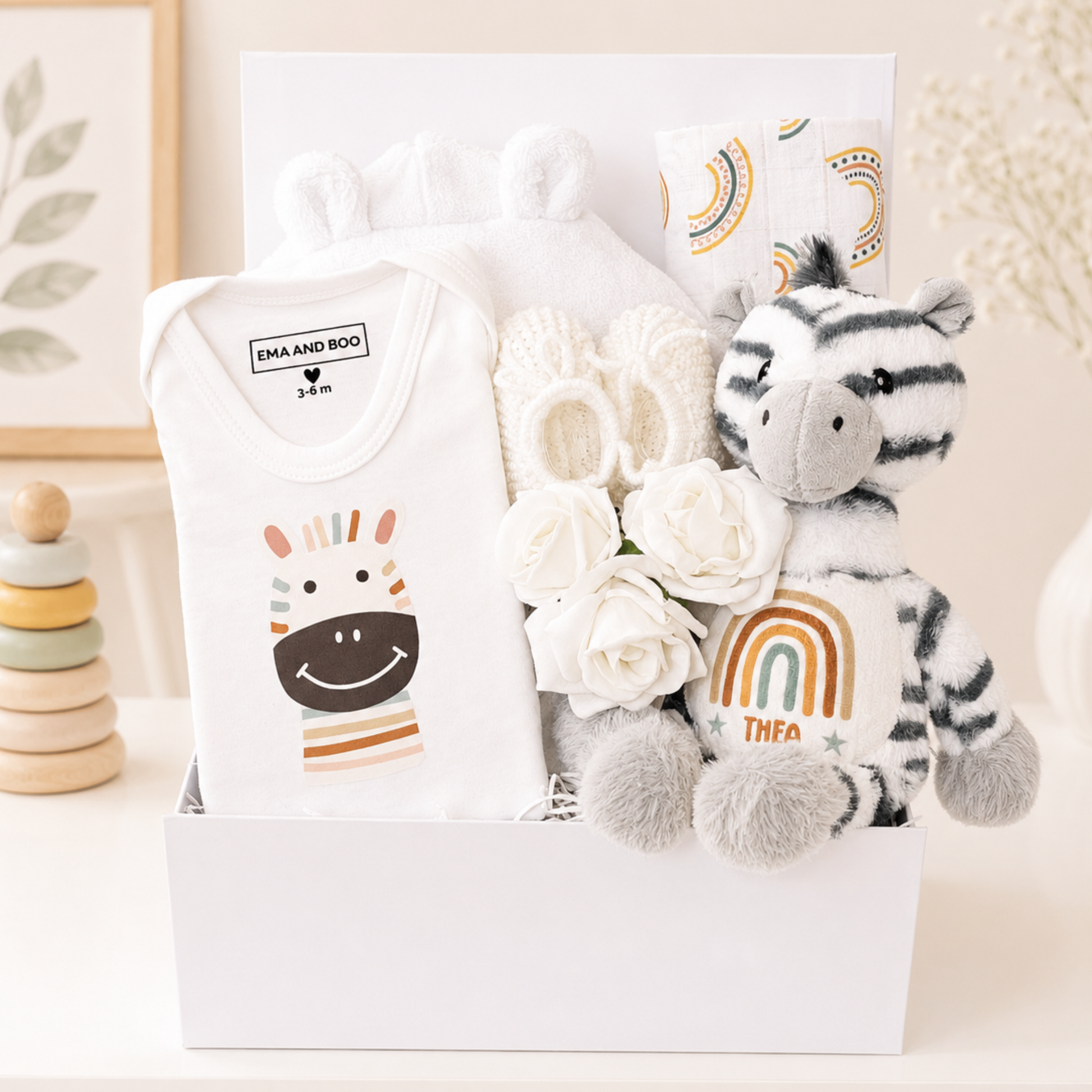 Personalised zebra baby gift box with robe, booties and bodysuit.