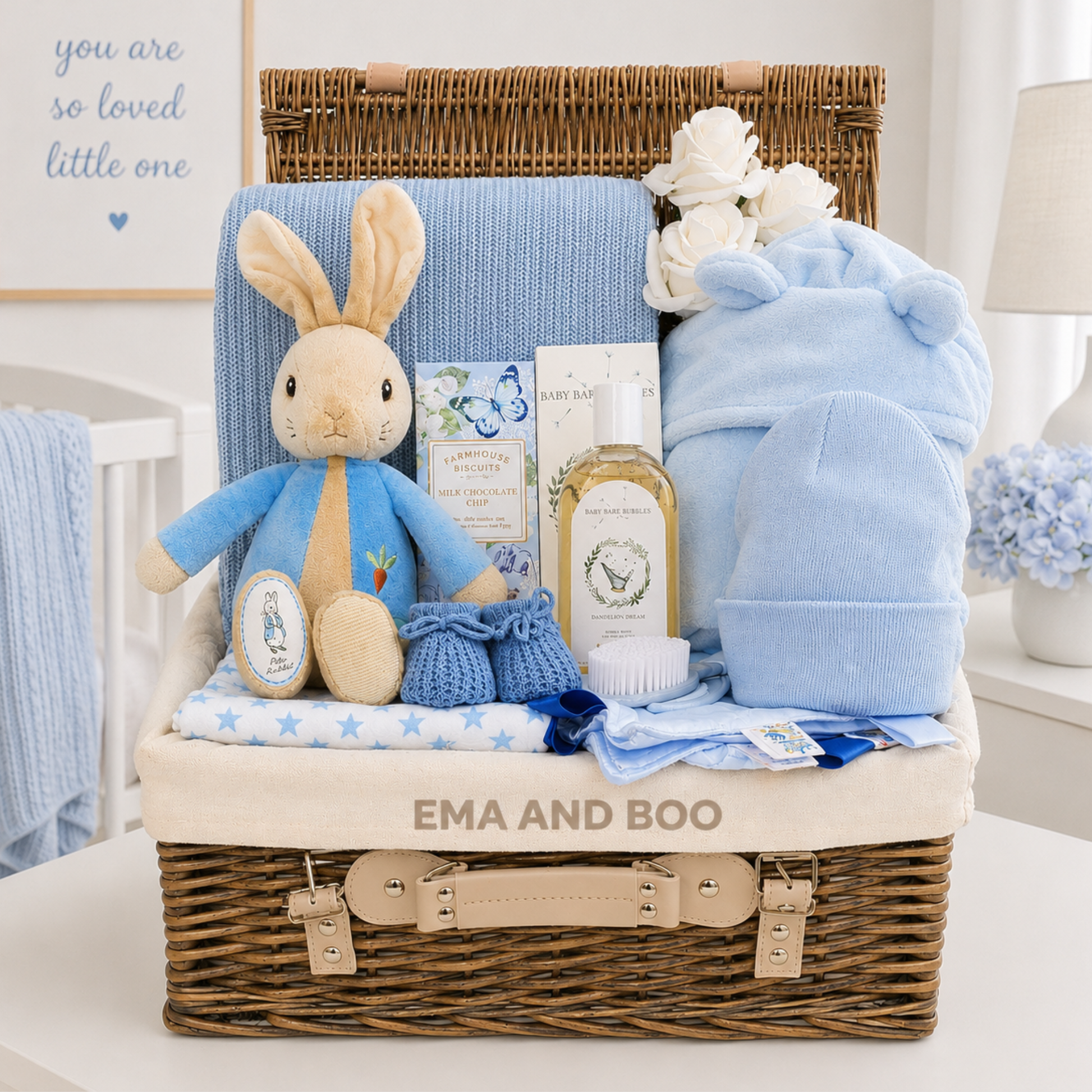 Luxury baby boy gift basket with official Peter Rabbit toy, blue baby essentials, luxury wicker hamper and newborn gifts