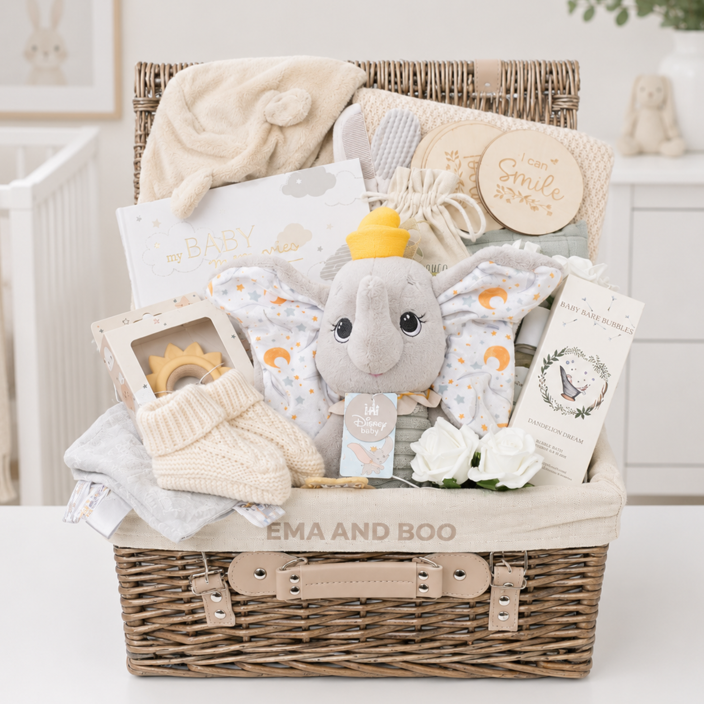 Luxury Disney Dumbo baby hamper in exclusive Ema & Boo wicker hamper with premium newborn gifts