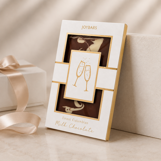 Colombian milk chocolate bar with champagne glasses design – ideal new parent gift or baby hamper add-on.