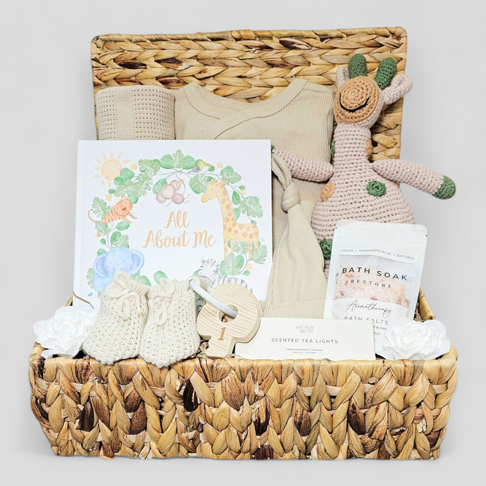 Baby hamper basket with keepsakes and pamper gifts for mum