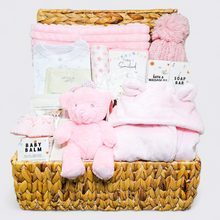 Load image into Gallery viewer, Luxury new baby hamper for girls in a water hyacinth basket with baby gifts
