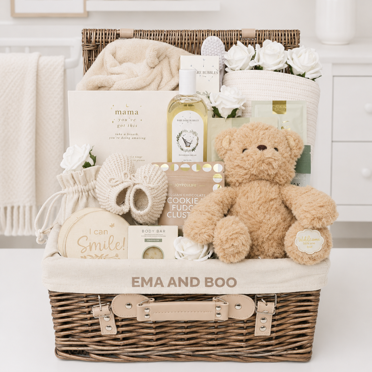 Luxury new mum and baby hamper with premium baby gifts, pamper treats and teddy bear in exclusive Ema & Boo wicker hamper
