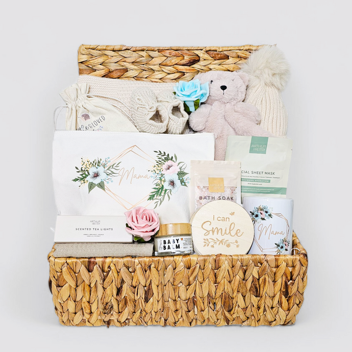 Luxury neutral new mum hamper in water hyacinth basket with baby gifts & pamper gifts for mum.