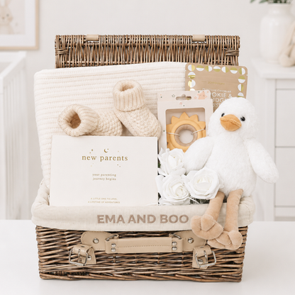Luxury new parents gift hamper with knitted baby blanket, premium baby essentials and gifts for parents in exclusive Ema & Boo wicker hamper.