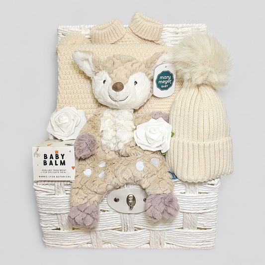 Neutral baby hamper with pom pom blanket, hat, booties, baby balm & Mary Meyer fawn soft toy