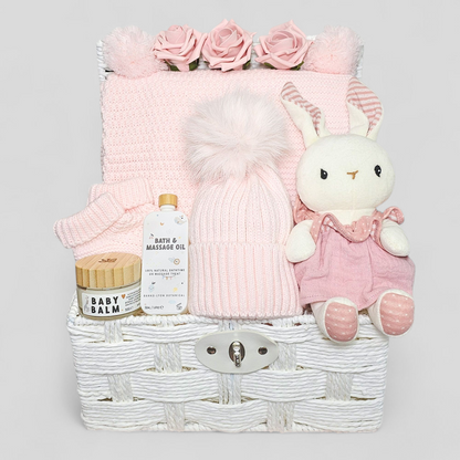 Luxury pink baby hamper with pom pom blanket, hat, booties, baby balm & organic bunny in dress