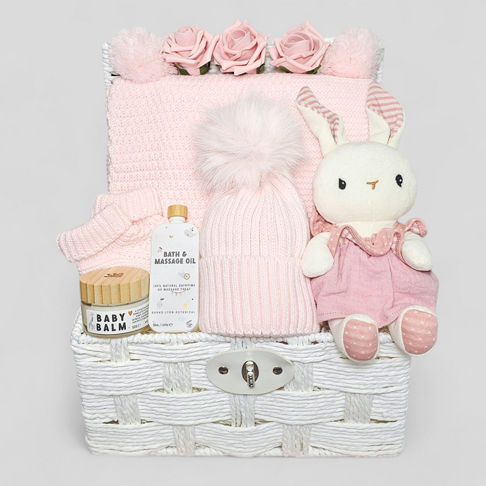 Luxury pink baby hamper with pom pom blanket, hat, booties, baby balm & organic bunny in dress
