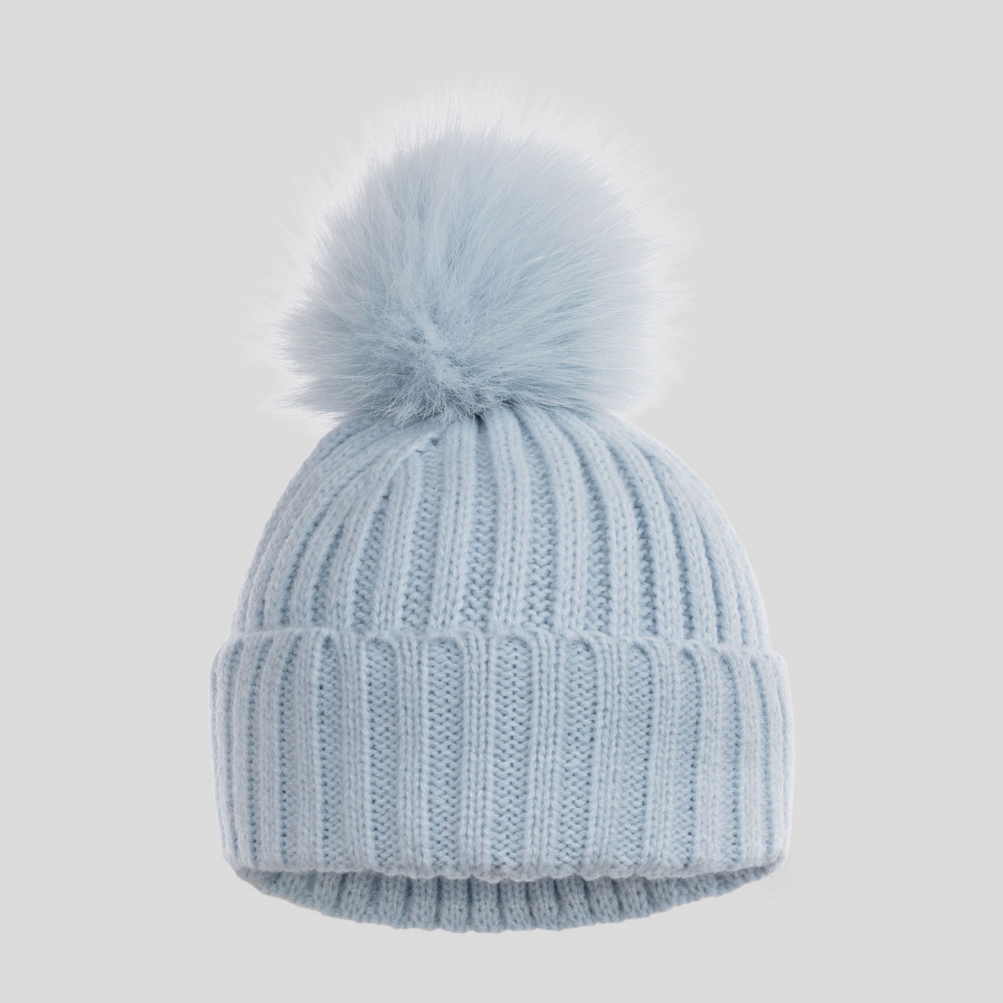 Light blue knit baby beanie with a fluffy pom-pom 