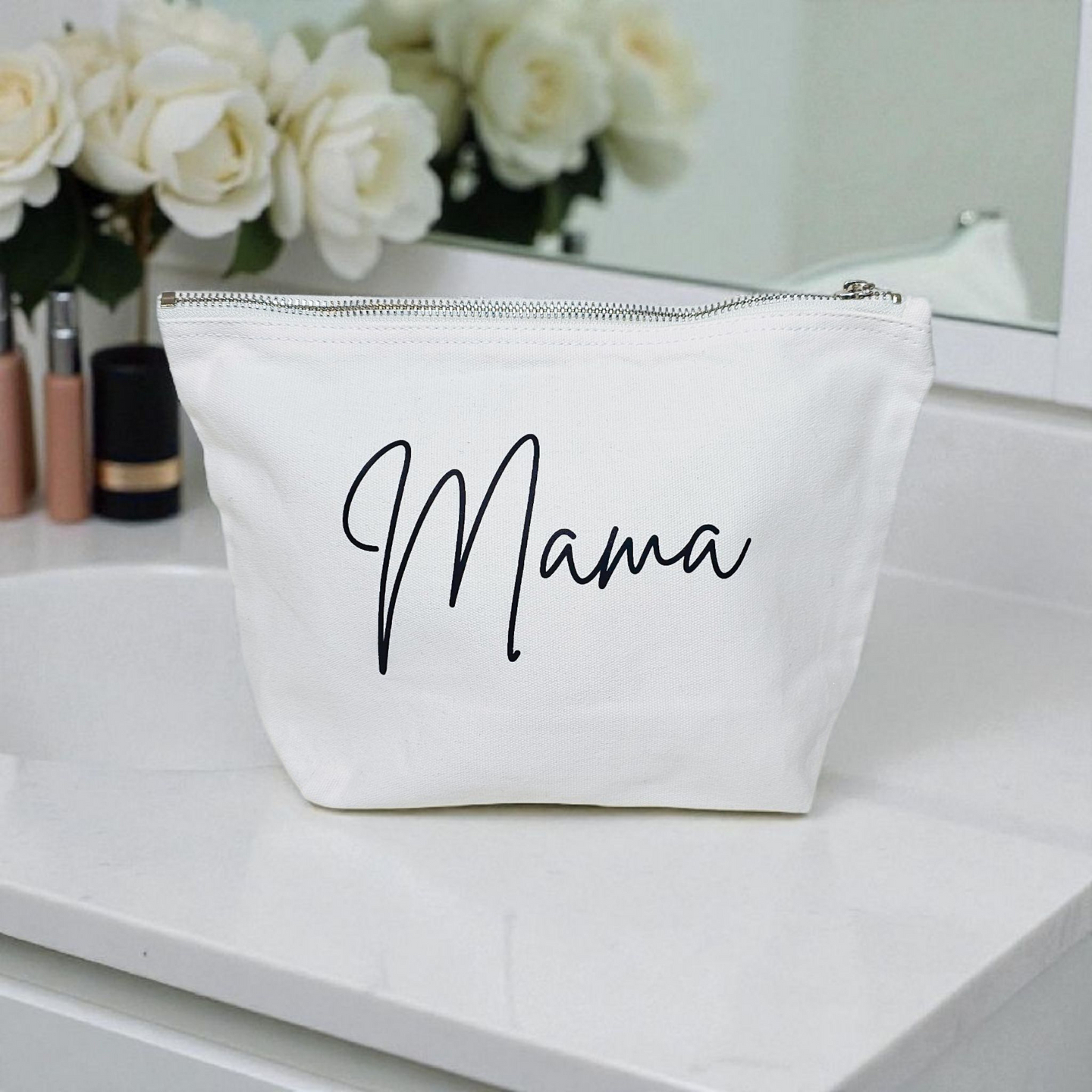 White canvas zip pouch with black “Mama” lettering