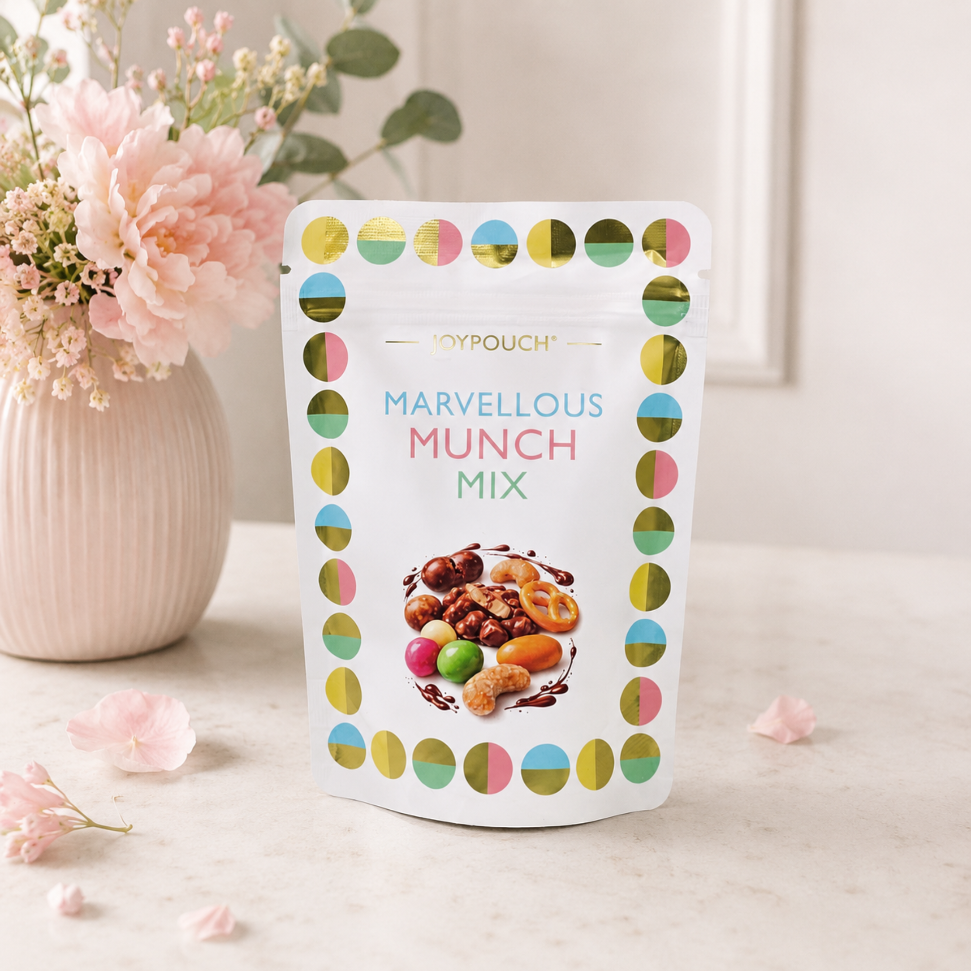 Marvellous Munch Mix JoyPouch filled with chocolate, sweets and crunchy snacks, perfect for luxury new mum gifts, baby hampers and gifts for new parents.