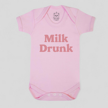 Load image into Gallery viewer, Pink baby onesie with &#39;Milk Drunk&#39; text 

