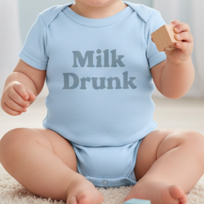 Blue Milk Drunk baby bodysuit with dusky blue writing