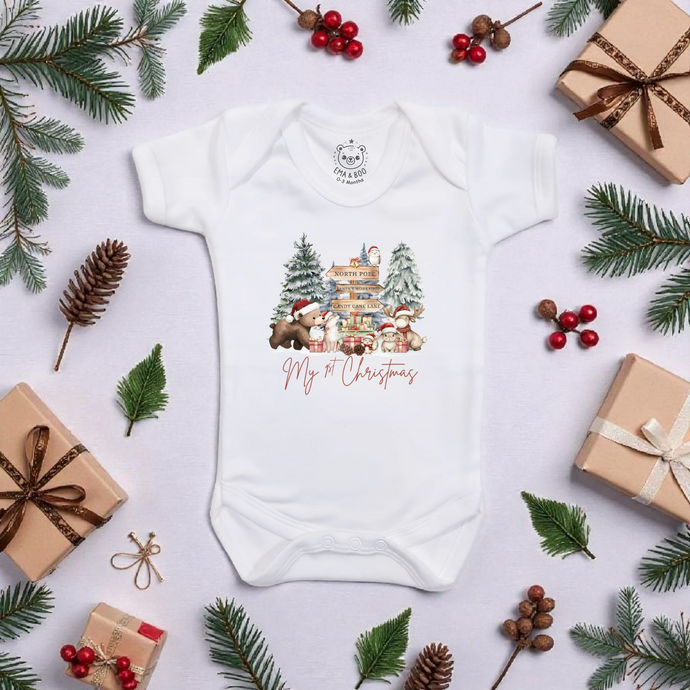 White baby bodysuit with “My 1st Christmas” North Pole print – festive Christmas baby outfit