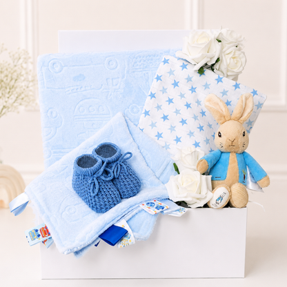 Baby boy gift box with My First Peter Rabbit and blue baby essentials.