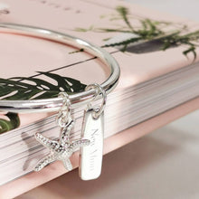 Load image into Gallery viewer, Silver bangle with starfish and rectangular charm 
