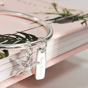 Silver bangle with starfish and rectangular charm 