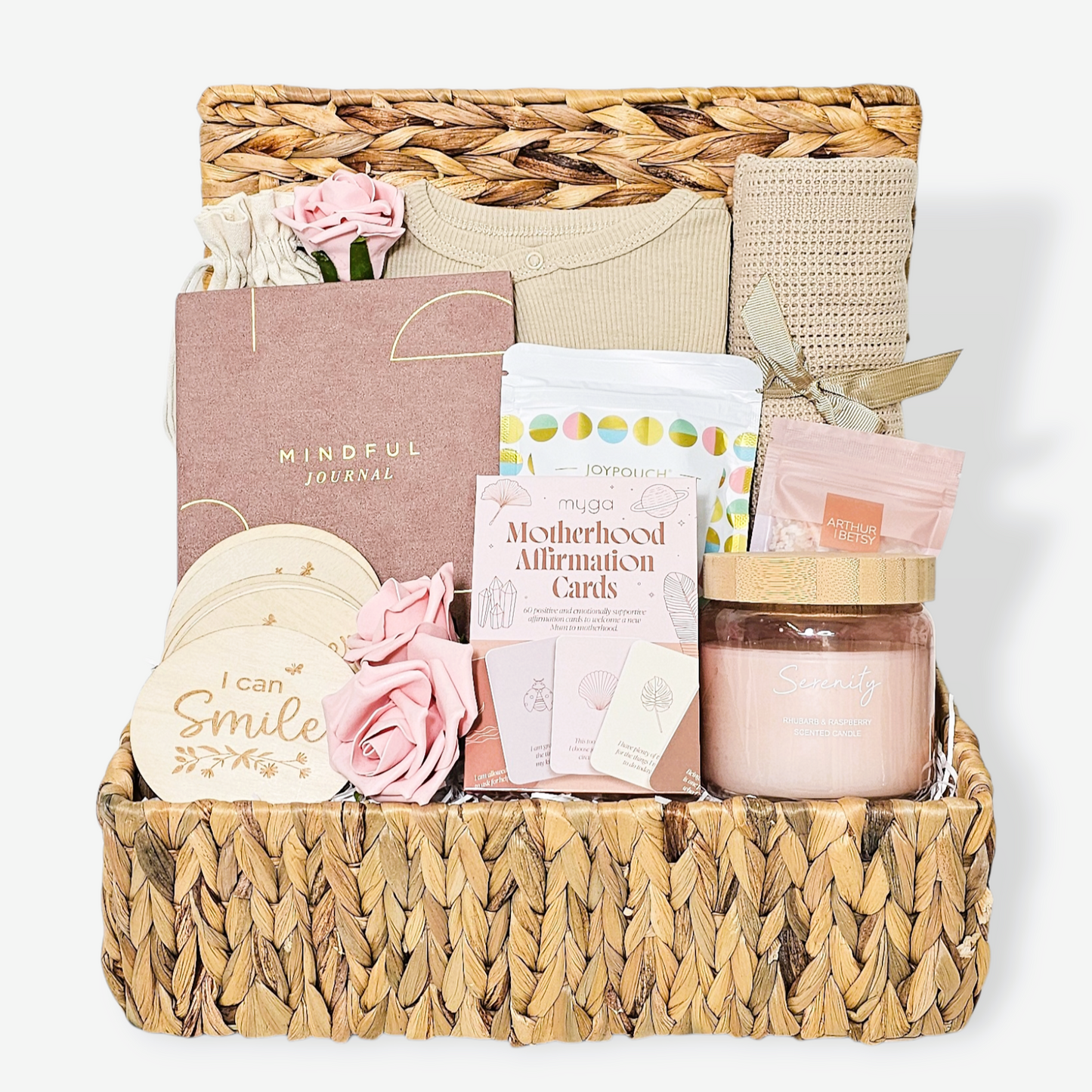 New mum and baby hamper with mindful journal, candle, snack mix, baby blanket and newborn sleepsuit.