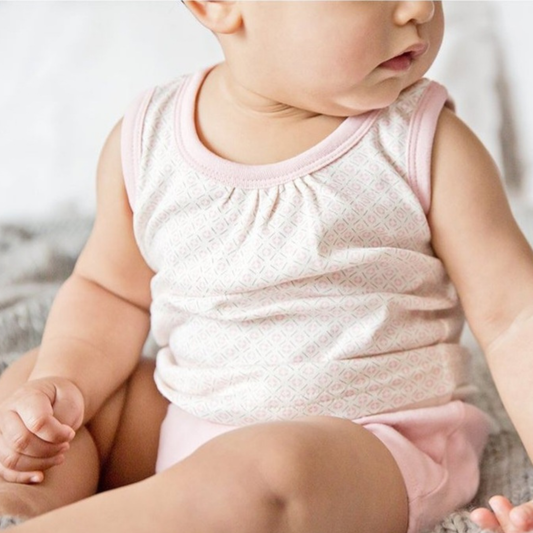 Pink organic cotton baby vest top 0–3 months worn by baby, newborn baby girl clothing gift