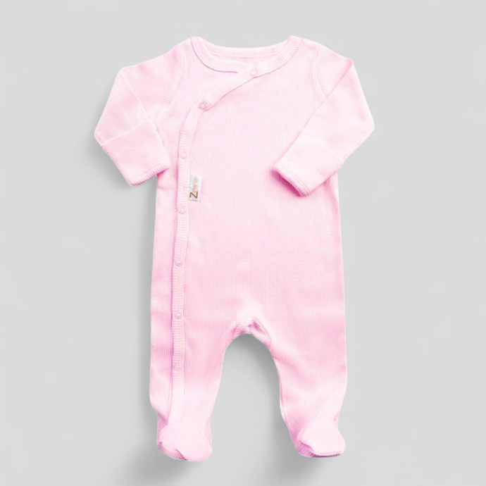 Light pink ribbed newborn sleepsuit with front poppers